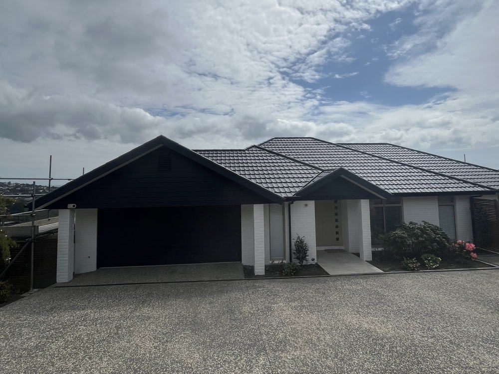 Modern Christchurch house with a freshly painted dark grey concrete tile roof